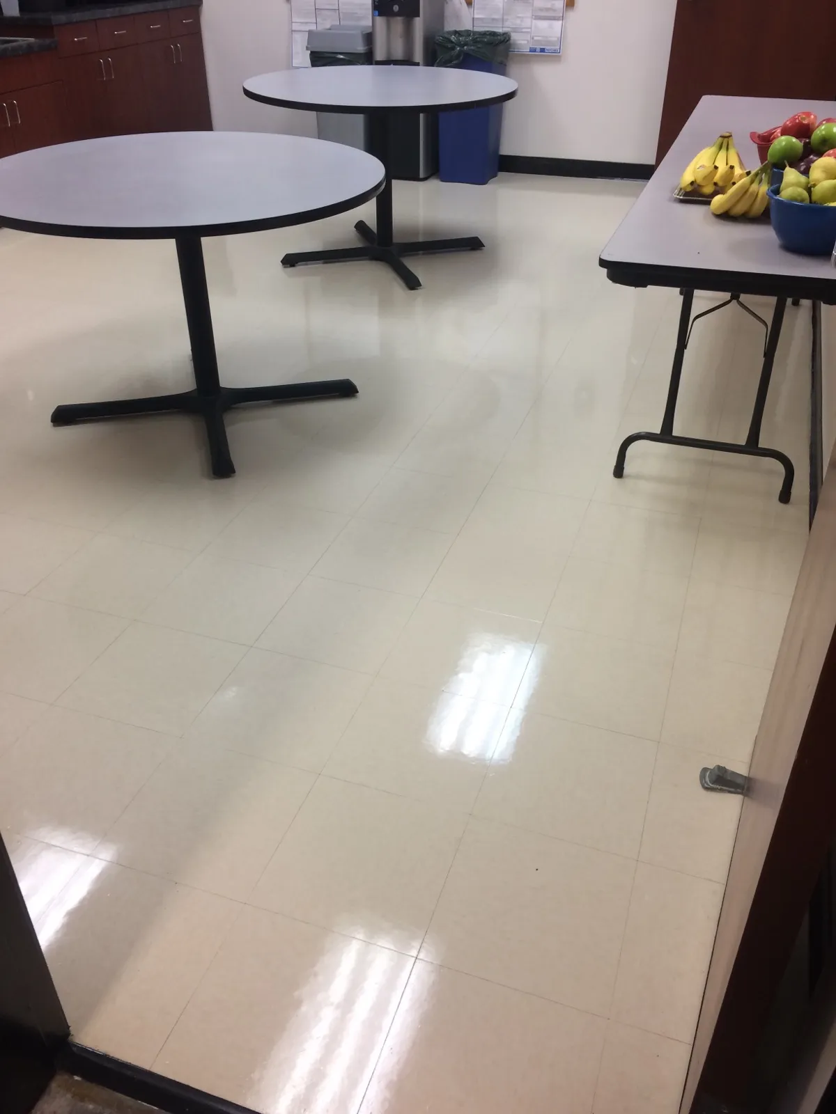 Freshly cleaned office break room with polished floors